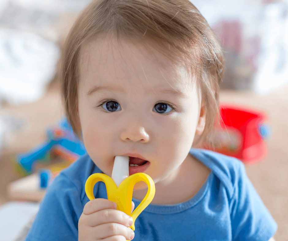 sleep training while teething blog post; baby chewing on a teething toy